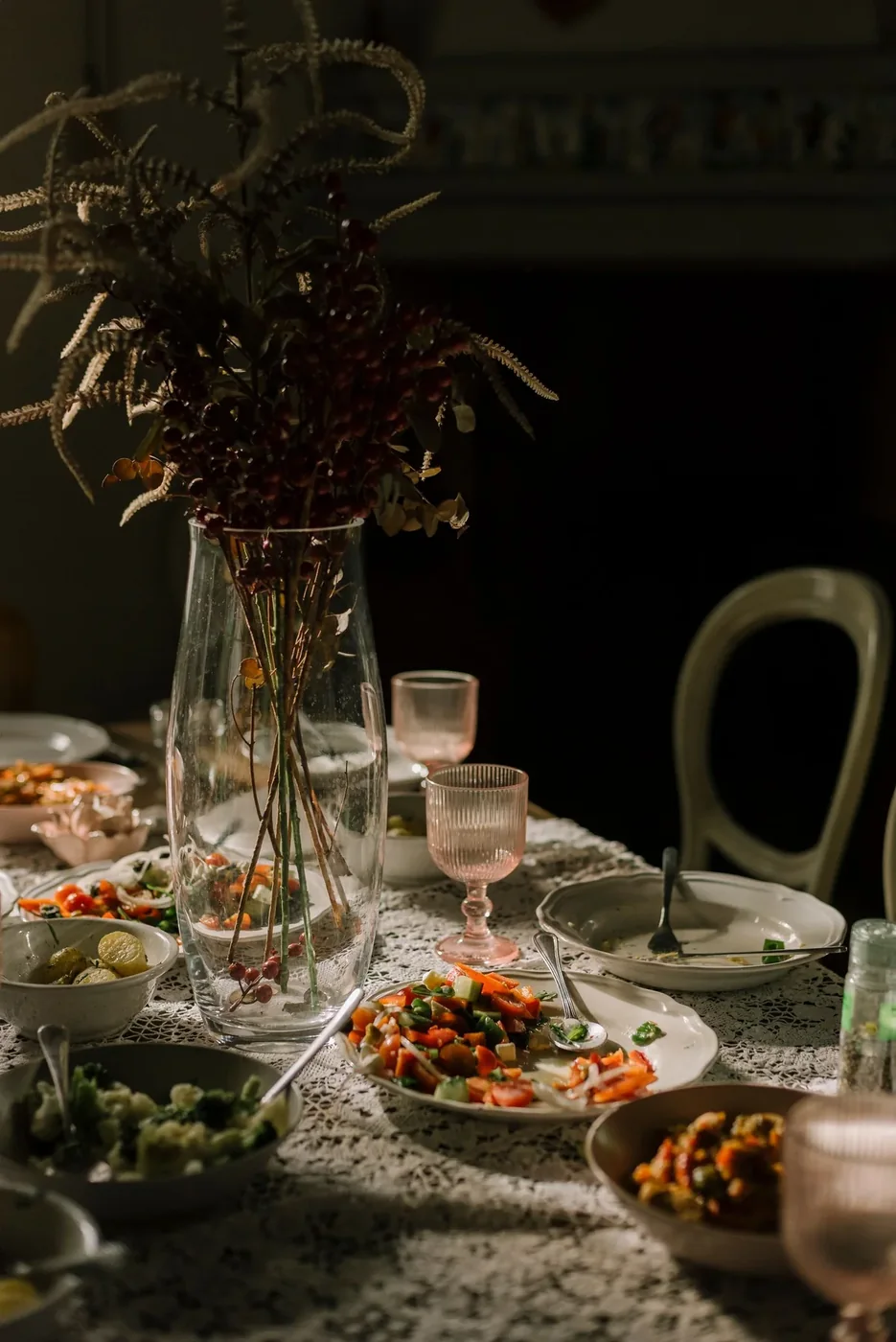 A welcoming dining table with flowers and food